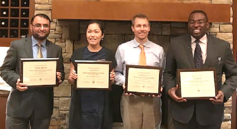 Among the first to complete the medical educator development program are, from left, Rizvi, Chan, Rau and Momah.